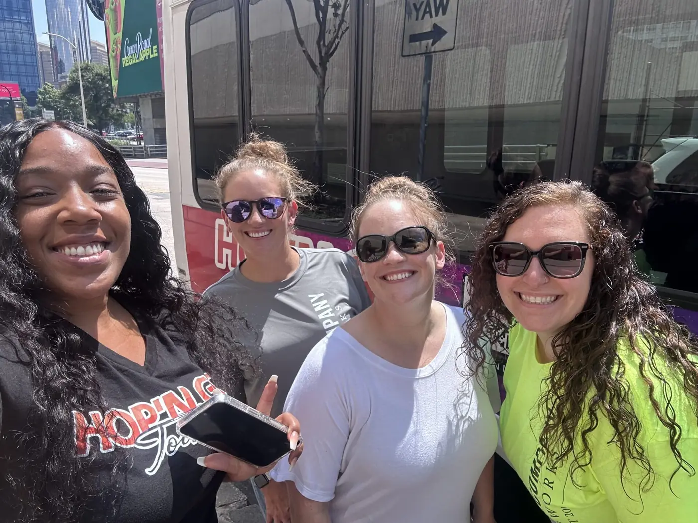 Tour host smiling with three guests