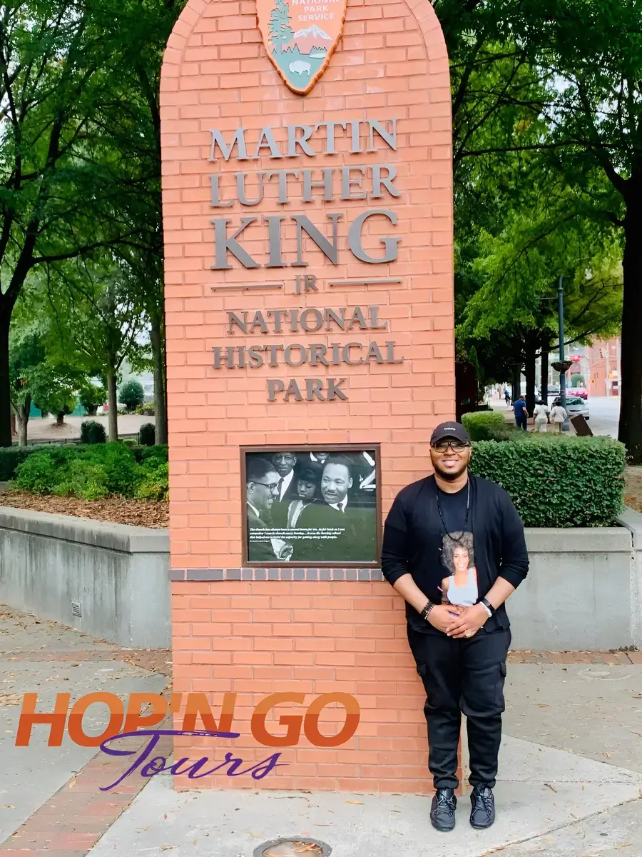 Guest at the Martin Luther King Jr. National Historical Park sign