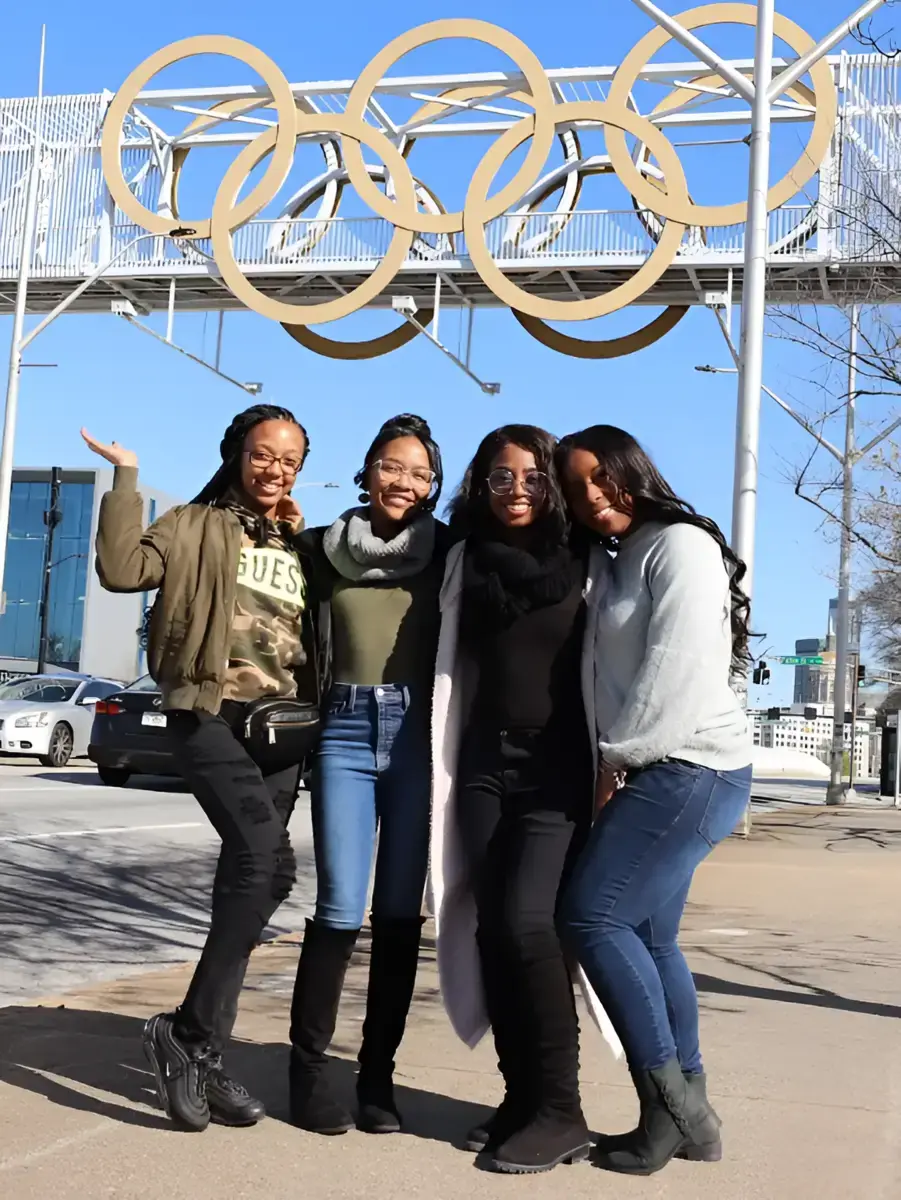 Guests posing at the Olympic rings in Centennial Olympic Park