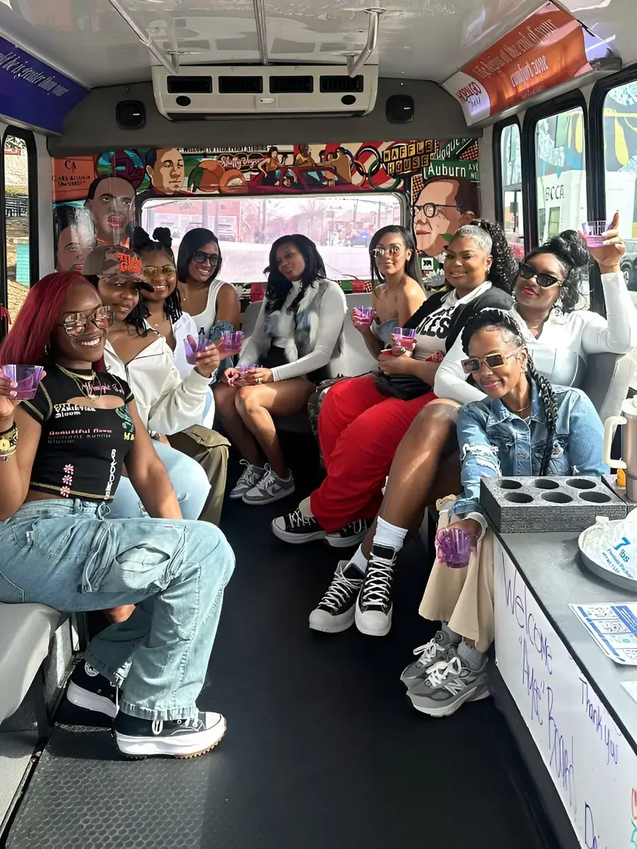 A group of guests celebrating on board the Hop'N Go bus